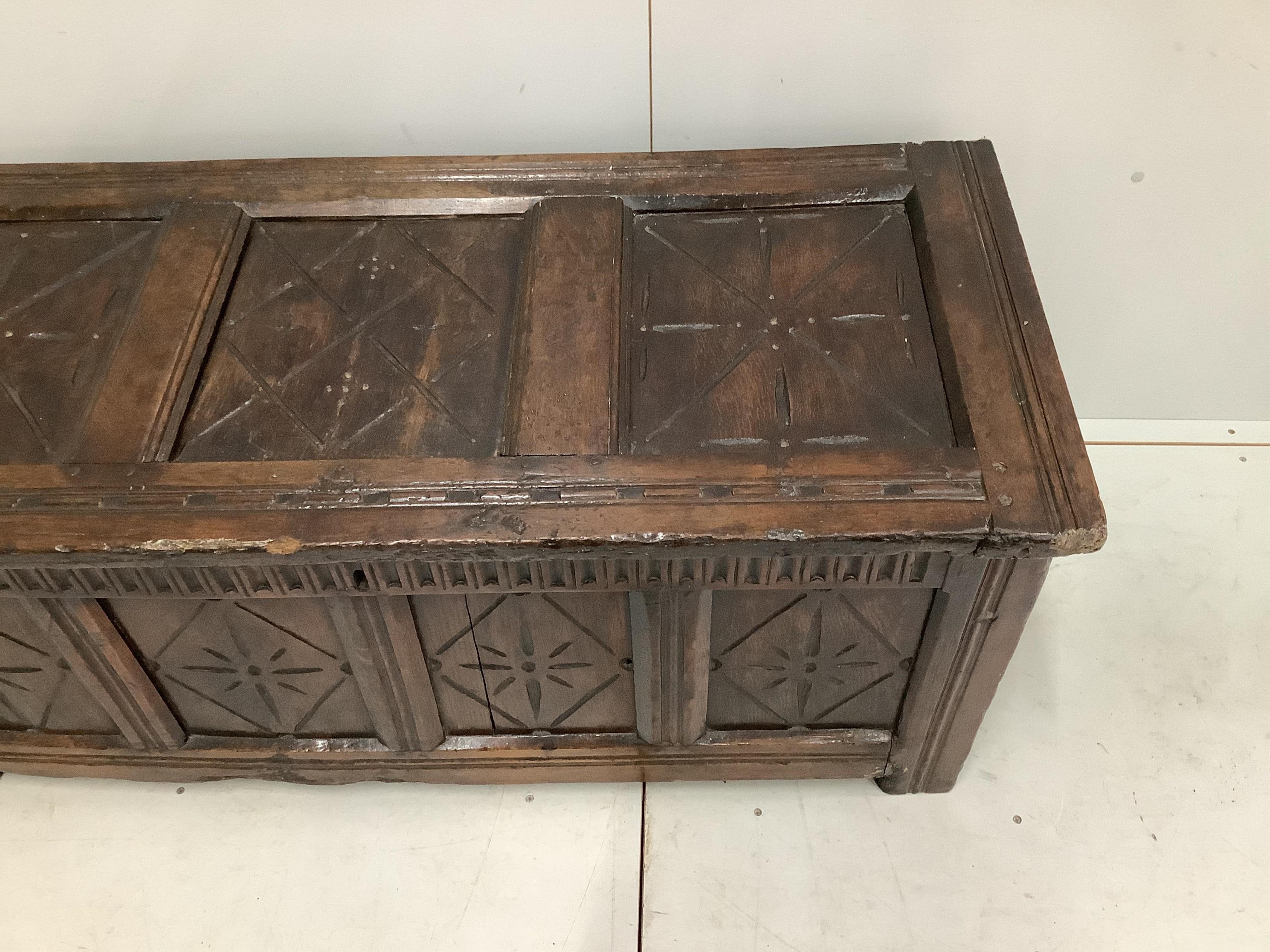 An early 18th century and later oak coffer, width 132cm, height 58cm. Condition - poor